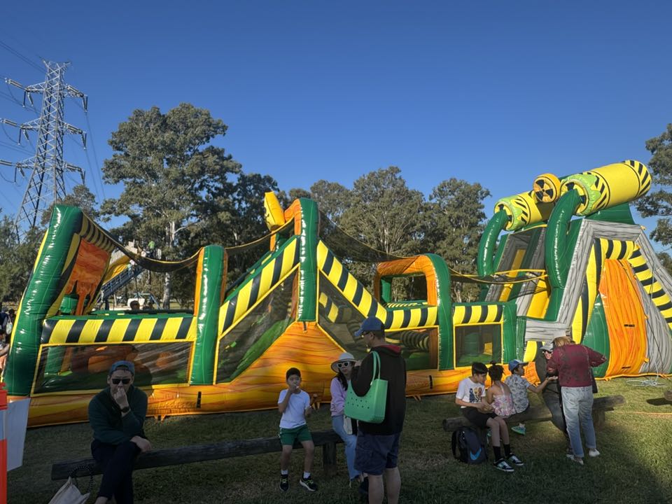 Giant inflatable obstacle course with families